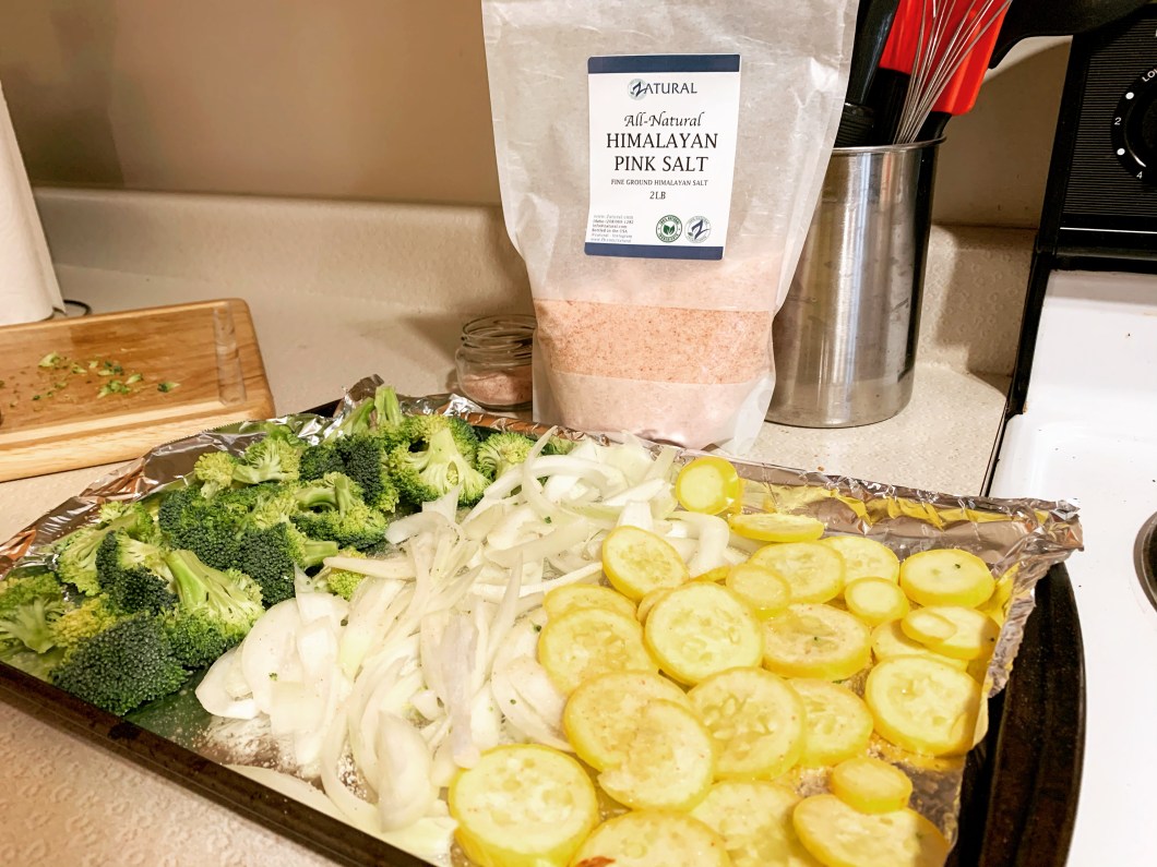 Broccoli, onion, and yellow squash with pink salt.