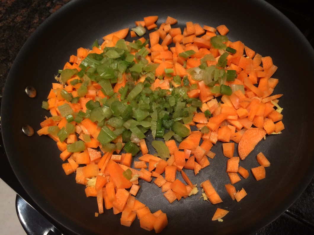 chopped celery and carrots in a pan