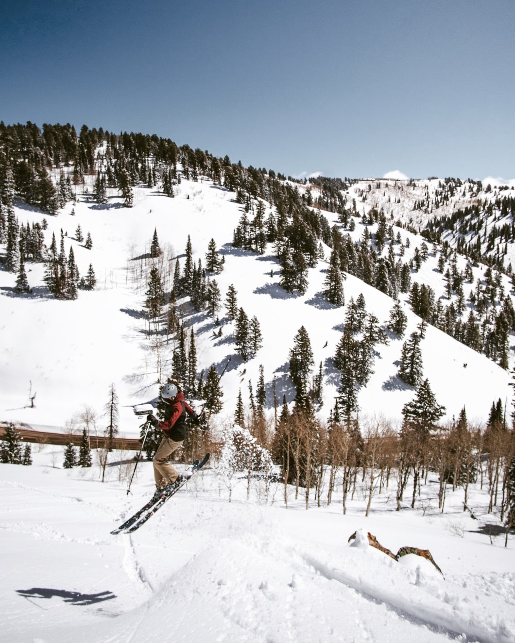 skier doing a 360 off a cliff