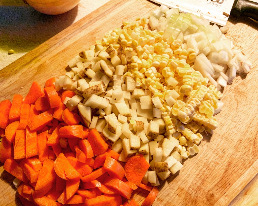 diced carrots, potatoes, corn, and onions