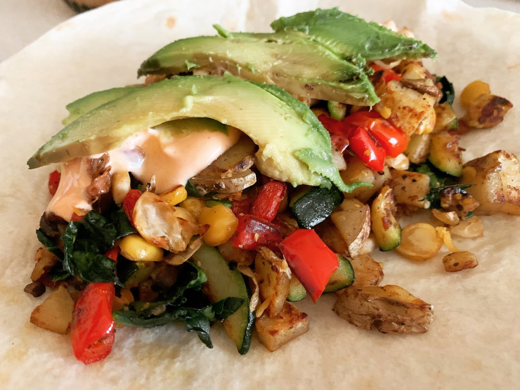 avocado on vegan chickpea breakfast burrito