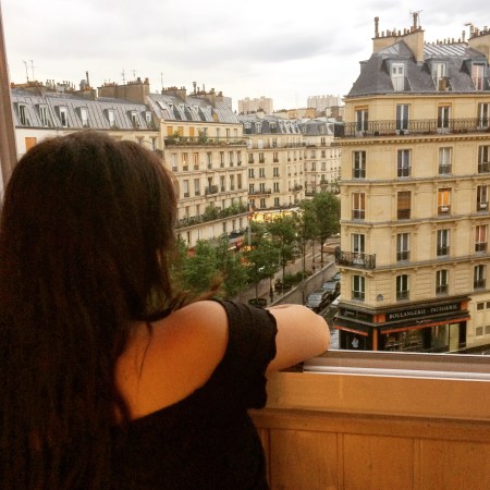 looking out a window in Paris france