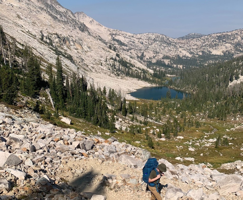 hiking the steep rock fields to get to the top of the pass on Toxaway/ Alice Lake trail loop in the Sawtooths