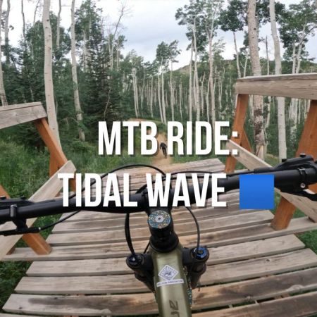 mountain biking trail ride at deer valley resort park city - blue square flowy trail tidal wave jump line