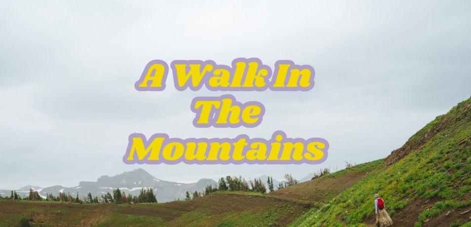a landscape along a green mountain ridge with pointy mountains in the back and a woman with a red backpack walking along the ridge trail
