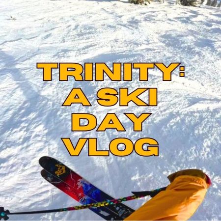 Point of view of a person jumping on their skis into some bumpy snow, with title that says" Trinity: A ski Day vlog"