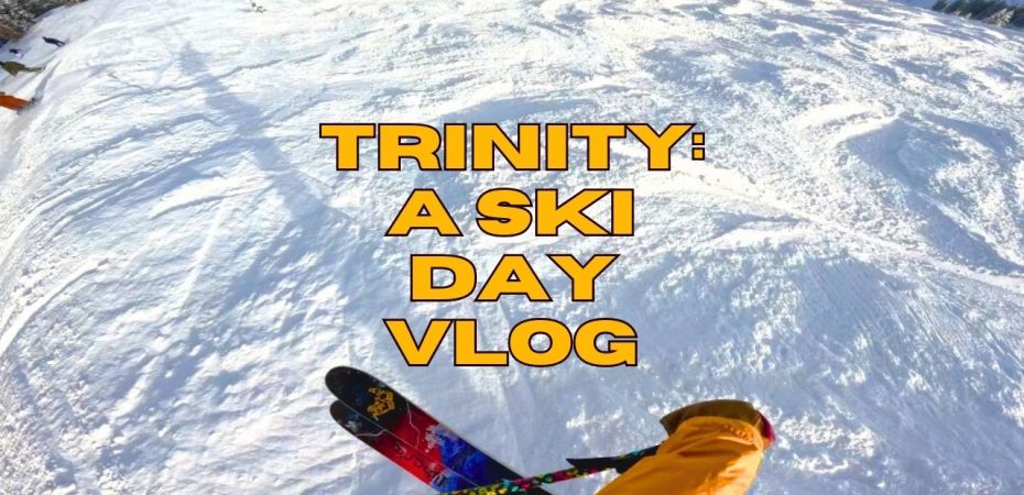 Point of view of a person jumping on their skis into some bumpy snow, with title that says" Trinity: A ski Day vlog"