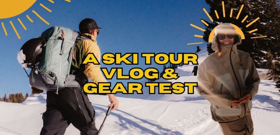 a backcountry skier with a backpack on the left, walking up a snowy hill, a woman wearing a green outerwear kit, with a yellow sun behind her head